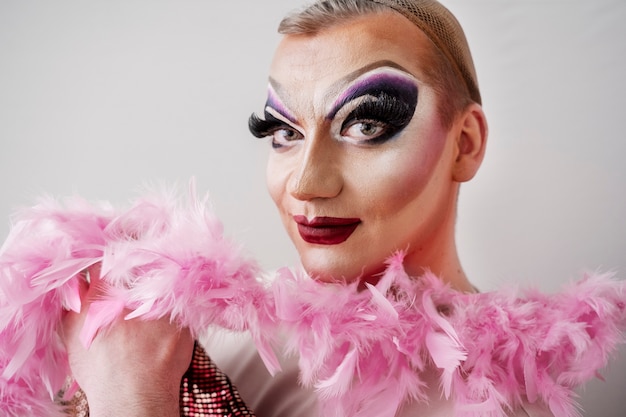 Side view drag queen wearing feathers