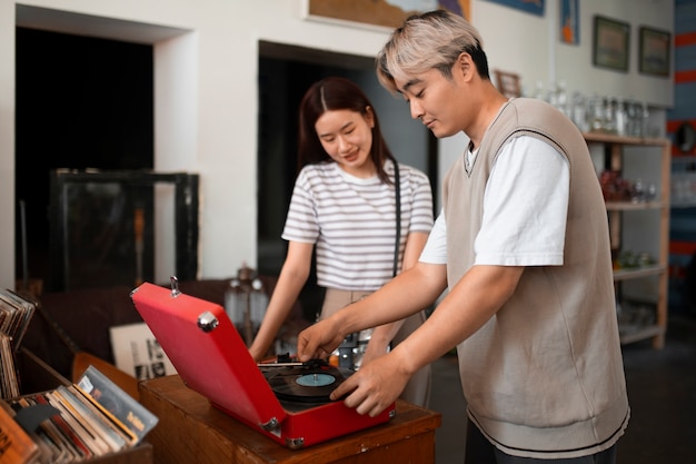 Side view friends with vinyl record