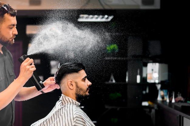 Side view of man getting a new hairstyle