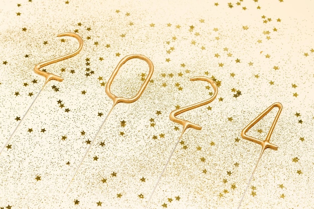 Side view of number 2024 with sparkles and glitter on beige isolated background The concept of New Year and Christmas congratulating colleagues and loved ones