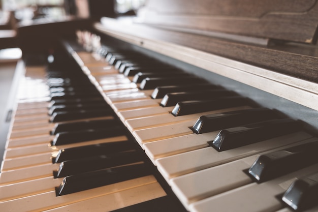 side view old piano keyboard in cafe with old vintage tone