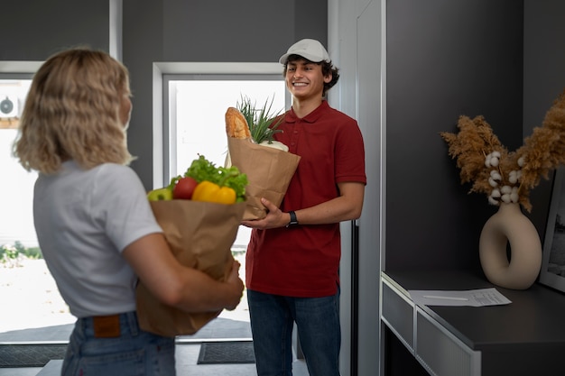 Side view people holding groceries