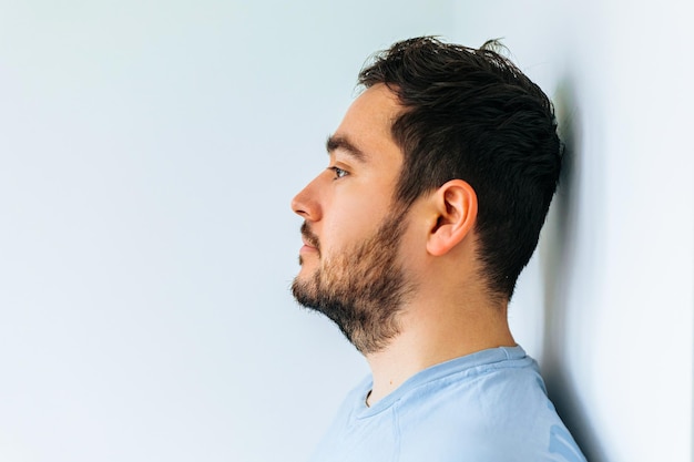 Side view of a portrait of a bearded man and eyeglasses