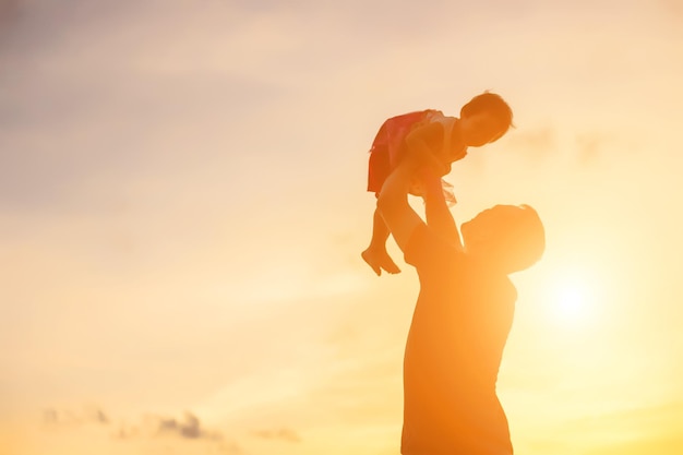 Side view of silhouette woman standing against sky during sunset