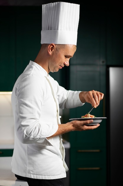 Side view smiley man cooking