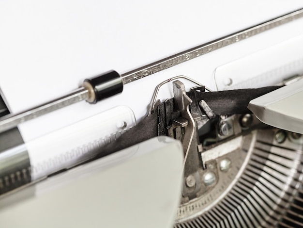 Side view of typebar types ribbon in typewriter