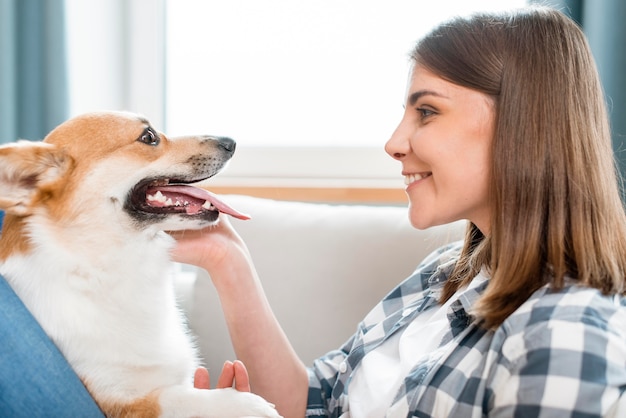 Side view of woman and her dog