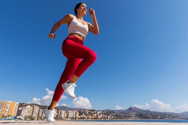 Side view woman running outdoors