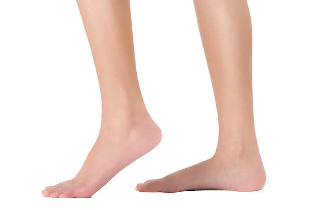 Side view of woman's feet in walking pose, Isolated on white background.