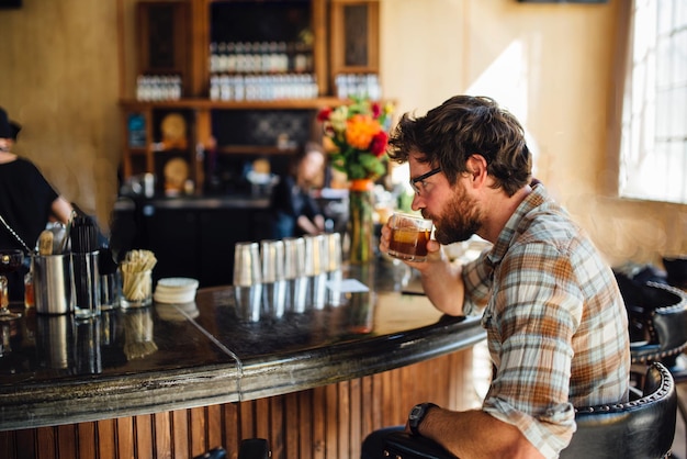 Side view of woman sitting in restaurant