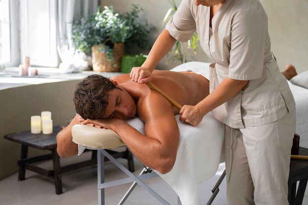 Side view woman working at a spa