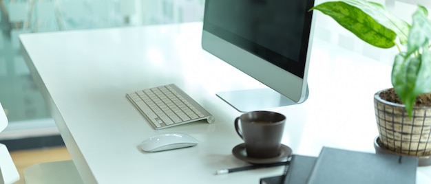 Side view of working table with computer