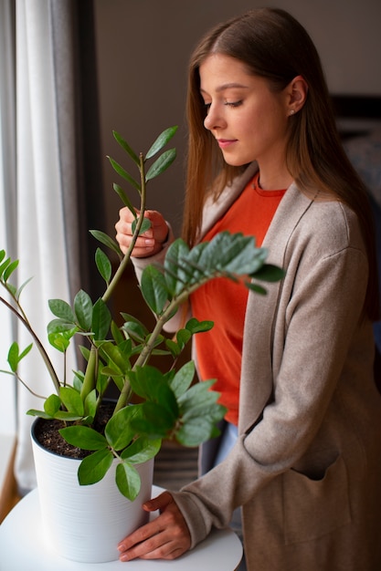 Side view young woman spending time at home