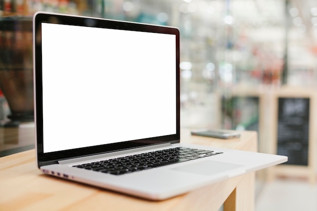 Sideview laptop with copyspace on wooden surface