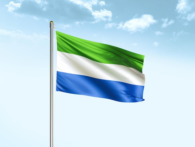 Sierra Leone national flag waving in blue sky with clouds Sierra Leone flag 3D illustration