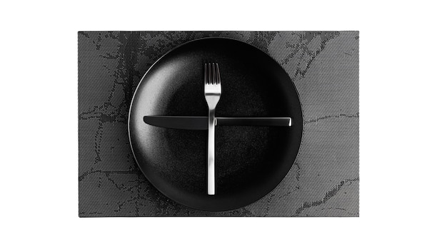 Sign language with cutlery. A plate with cutlery isolated on a white background. Plate, knife, fork on a white background. High quality photo