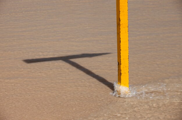 Sign shadow over wave