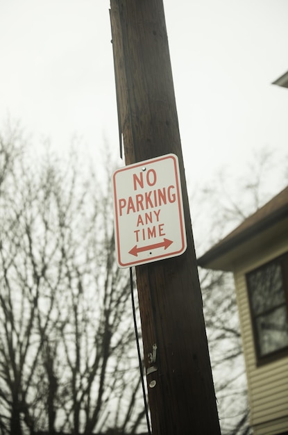 A sign that says no parking any time on it