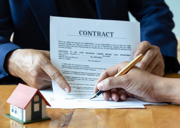 Photo signing a home purchase contract.