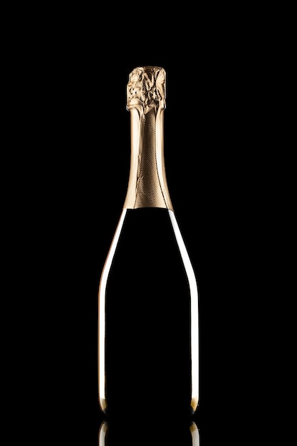 Silhouette of closed bottle of champagne without label isolated on black background