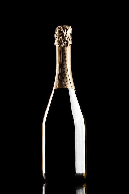 Silhouette of closed bottle of champagne without label isolated on black background