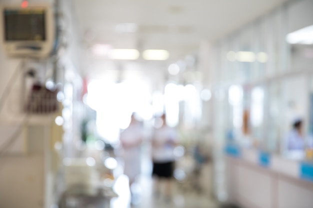 Silhouette of a doctor walking in a hurry in the hospital corridor.