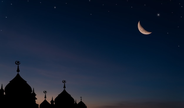 Silhouette dome mosques and crescent moon on dusk sky symbol of religion Islamic Ramadan Muharram