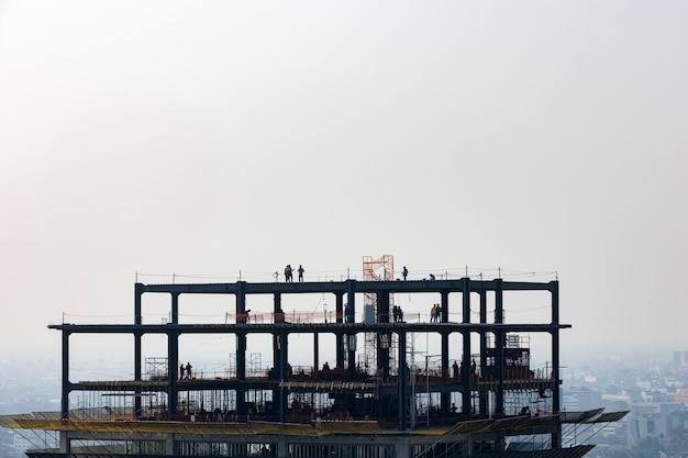 Silhouette of engineer and construction team working at site in Mexico city