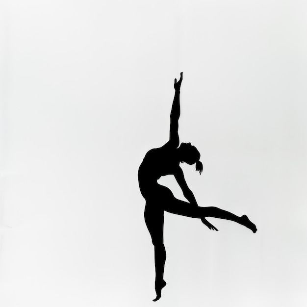 Silhouette of a female gymnast in a graceful pose