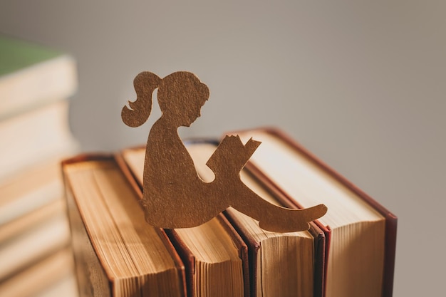 Silhouette of a girl reading a fairy tale