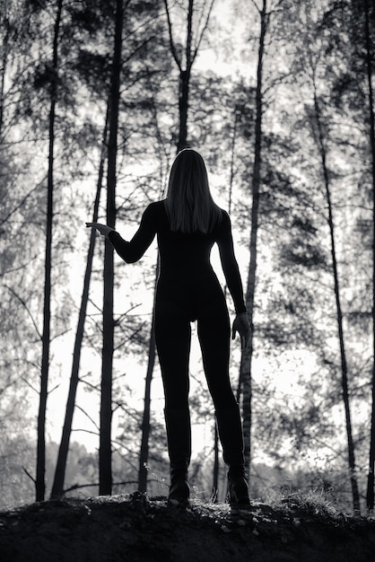 Silhouette of a Girl with a beautiful body in the Forest