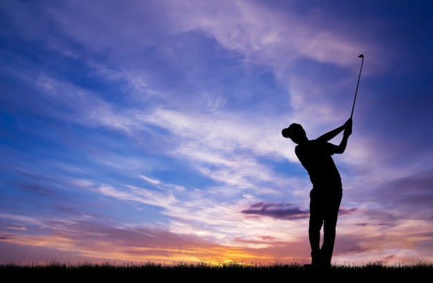 silhouette golfer playing golf during beautiful sunset