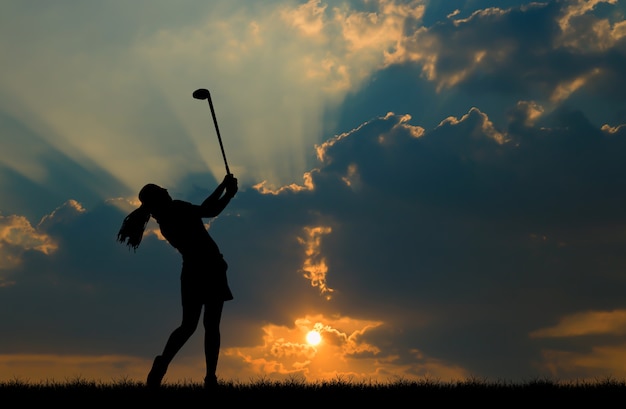 silhouette golfer playing golf during beautiful sunset