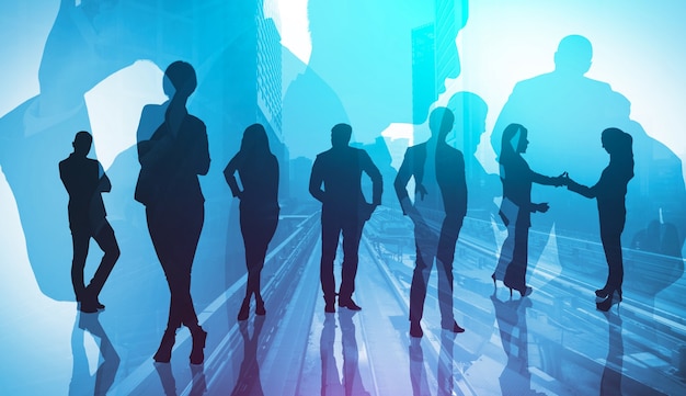 Silhouette image of business people group on city background