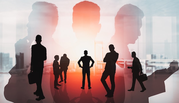 Silhouette image of business people group on city background