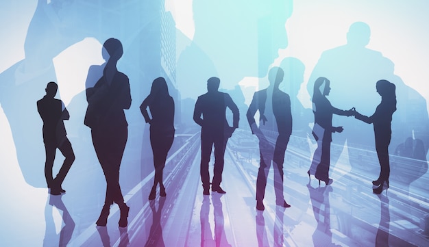 Silhouette image of business people group on city background