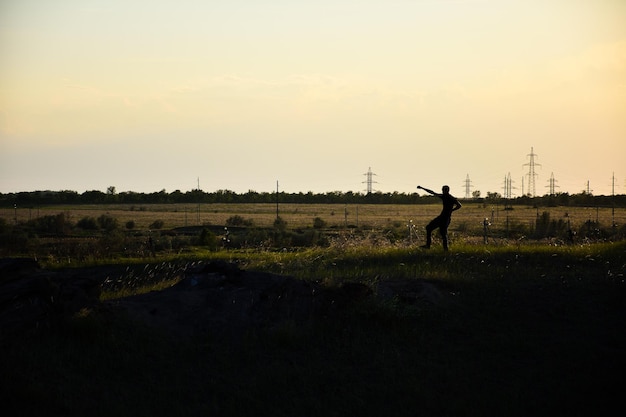 Silhouette of a man in a field