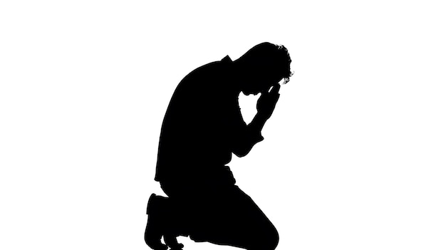 Photo silhouette man in prayer