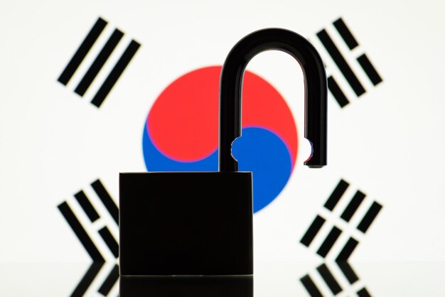 Silhouette of open lock and flag of South Korea