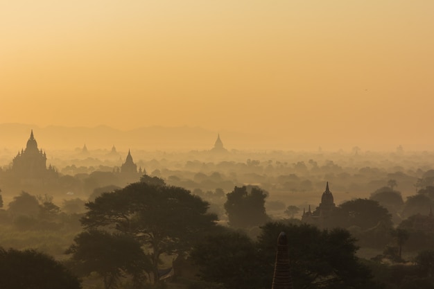 Silhouette pagoda on sunrise time in morning and balloon at Bagan, Myanmar