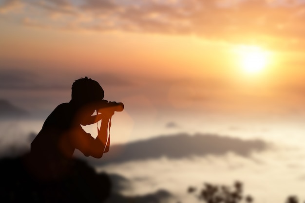 Silhouette of photographer taking pictures