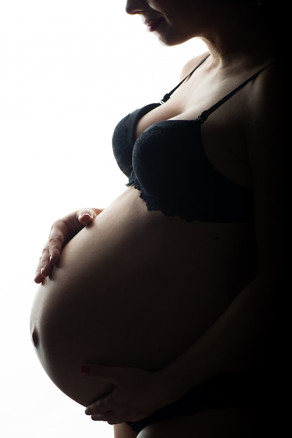 Silhouette of Pregnant woman on a white background