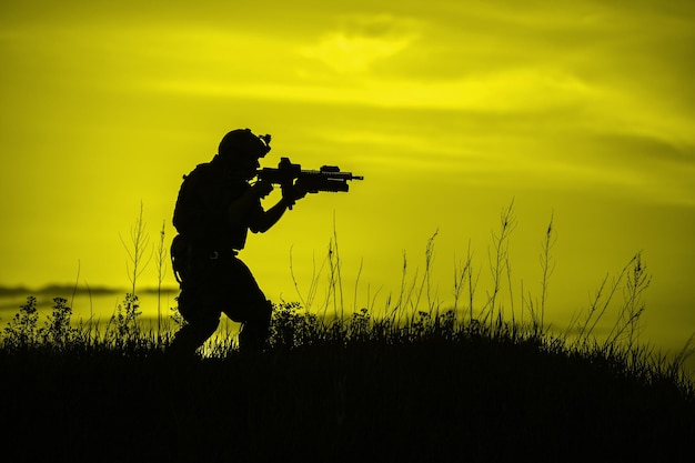 Silhouette of soldier with riflexAxA