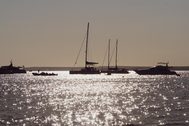 Silhouette of some boats in the mediterranean sea at sunset