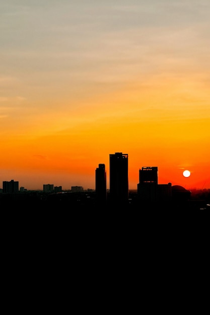 The silhouette sunset over Bangkok city skyline verticle picture