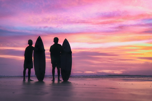 Silhouette surf athlete during sunset time at Phuket Thailand