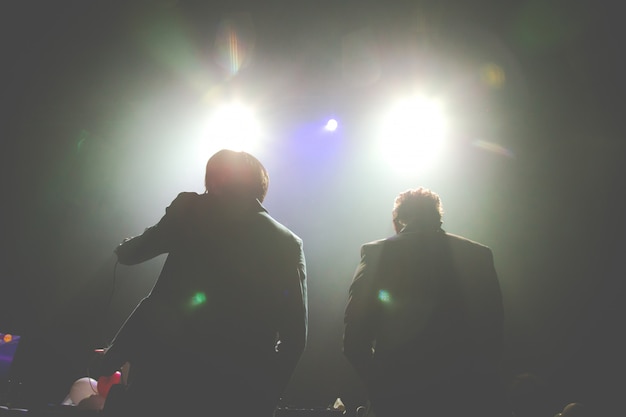 Silhouette of Two DJ performing at a concert