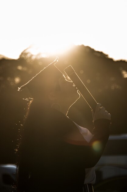 Photo silhouette of woman graduating in rio de janeiro, brazil.