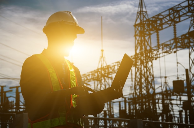 Silhouette of working engineer in the construction site