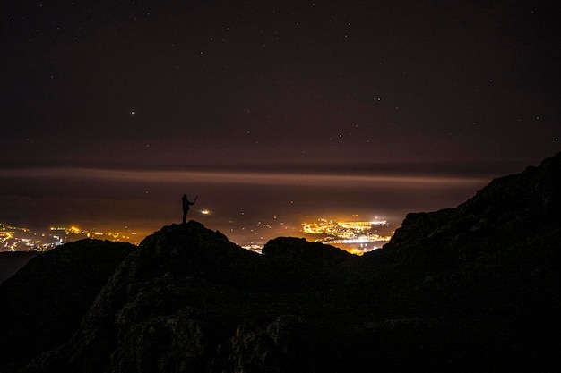 Silhouette of a young man on the mount of Aiako Harria in Oiartzun Basque Country